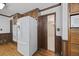 Bright kitchen with wood cabinets, granite counters, and a large refrigerator at 3520 Tom Brewer Rd, Loganville, GA 30052