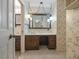 Bathroom features a vanity with mirror and floral wallpaper at 3520 Tom Brewer Rd, Loganville, GA 30052