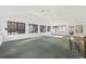 Spacious sunroom with large windows, ceiling fans, and brick wall at 3520 Tom Brewer Rd, Loganville, GA 30052