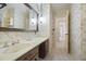 Bathroom with vanity, sink, mirror and view to bedroom at 3520 Tom Brewer Rd, Loganville, GA 30052