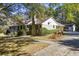Brick ranch house with attached garage and landscaping at 3520 Tom Brewer Rd, Loganville, GA 30052