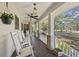 Spacious front porch with rocking chairs, overlooking a scenic landscape at 3520 Tom Brewer Rd, Loganville, GA 30052