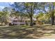 Brick ranch house with large yard and mature trees at 3520 Tom Brewer Rd, Loganville, GA 30052