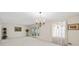 Spacious dining room with a chandelier and access to the outdoors at 3520 Tom Brewer Rd, Loganville, GA 30052