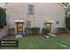 Brick building exterior with two basement entrances and landscaping at 3520 Tom Brewer Rd, Loganville, GA 30052