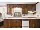 Kitchen with wood cabinets, granite countertops and built-in oven at 3520 Tom Brewer Rd, Loganville, GA 30052