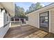 Wooden deck overlooks backyard with access to detached garage at 3520 Tom Brewer Rd, Loganville, GA 30052