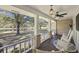 Serene front porch showcasing a picturesque pond view at 3520 Tom Brewer Rd, Loganville, GA 30052