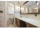Retro bathroom with a large vanity mirror and floral wallpaper at 3520 Tom Brewer Rd, Loganville, GA 30052
