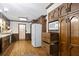 Kitchen boasts wood cabinets, granite countertops and a large refrigerator at 3520 Tom Brewer Rd, Loganville, GA 30052