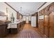 Kitchen with wood cabinets, white appliances, and hardwood floors at 3520 Tom Brewer Rd, Loganville, GA 30052