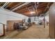 Unfinished basement with exposed pipes and ample storage space at 3520 Tom Brewer Rd, Loganville, GA 30052