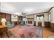 Cozy living room featuring a brick fireplace and built-in shelves at 3520 Tom Brewer Rd, Loganville, GA 30052