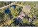 Aerial view of home, shop, pond, and large lot at 3520 Tom Brewer Rd, Loganville, GA 30052