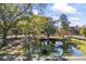 Picturesque pond view with tree reflections and fall colors at 3520 Tom Brewer Rd, Loganville, GA 30052