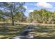 Long driveway leading to home, with pond views at 3520 Tom Brewer Rd, Loganville, GA 30052
