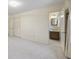 Spacious bedroom with neutral walls, carpeting, and an ensuite bathroom at 3520 Tom Brewer Rd, Loganville, GA 30052