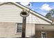 Charming vintage-style bell on post near home entrance at 3520 Tom Brewer Rd, Loganville, GA 30052