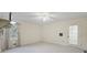 Bright bedroom with carpet flooring, window, and door leading outside at 3520 Tom Brewer Rd, Loganville, GA 30052