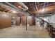 Unfinished basement area with exposed utilities and storage space at 3520 Tom Brewer Rd, Loganville, GA 30052