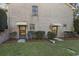 Brick building exterior with two basement entrances and landscaping at 3520 Tom Brewer Rd, Loganville, GA 30052