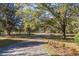 Driveway lined with trees and leading to a house at 3520 Tom Brewer Rd, Loganville, GA 30052