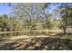 Scenic pond with lush trees and picnic table at 3520 Tom Brewer Rd, Loganville, GA 30052