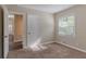 Spacious bedroom with carpet, neutral walls, and access to hallway at 3289 Beech Dr, Decatur, GA 30032