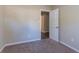 Spacious carpeted bedroom with neutral walls and an adjacent hallway at 3289 Beech Dr, Decatur, GA 30032