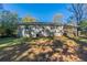 Ranch house rear view showcasing a large backyard at 3289 Beech Dr, Decatur, GA 30032