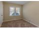 Cozy carpeted bedroom with neutral walls and large window at 3289 Beech Dr, Decatur, GA 30032