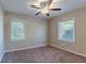 Bright bedroom with neutral walls, ceiling fan and carpet flooring at 3289 Beech Dr, Decatur, GA 30032