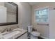 Updated bathroom with granite vanity and window at 3289 Beech Dr, Decatur, GA 30032