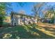 Side view of ranch house, showcasing backyard and fence at 3289 Beech Dr, Decatur, GA 30032