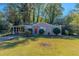 Ranch style house with carport and green lawn at 3289 Beech Dr, Decatur, GA 30032