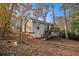 House exterior with deck and wooded backyard at 3060 Wilkes Plantation Way, Douglasville, GA 30135