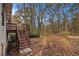 Backyard view showing deck and wooded area at 3060 Wilkes Plantation Way, Douglasville, GA 30135