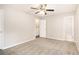 Spacious bedroom with ceiling fan and access to bathroom at 3060 Wilkes Plantation Way, Douglasville, GA 30135