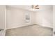 Bright bedroom with ceiling fan and plush carpeting at 3060 Wilkes Plantation Way, Douglasville, GA 30135