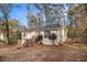 Front view of a cozy ranch house on a wooded lot at 3060 Wilkes Plantation Way, Douglasville, GA 30135