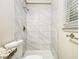 Clean bathroom with marble-tiled shower and granite countertop at 3811 Paul St, Douglasville, GA 30135