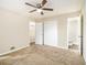 Spacious bedroom with ceiling fan and access to bathroom at 3811 Paul St, Douglasville, GA 30135
