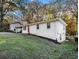 Side view of a brick ranch home with a grassy yard at 3811 Paul St, Douglasville, GA 30135