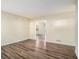 Open living room with neutral walls and wood-look floors at 3811 Paul St, Douglasville, GA 30135