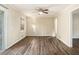 Spacious living room featuring wood-look floors and ceiling fan at 3811 Paul St, Douglasville, GA 30135
