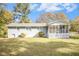 House backyard with screened porch and large grassy area at 4257 Midway Rd, Douglasville, GA 30134