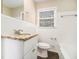 Clean bathroom, granite countertop, white cabinets, and a bathtub at 4257 Midway Rd, Douglasville, GA 30134