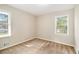 Well-lit bedroom with neutral walls and brown carpeting at 4257 Midway Rd, Douglasville, GA 30134