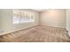 Spacious bedroom with neutral walls and brown carpeting at 4257 Midway Rd, Douglasville, GA 30134