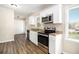 Modern kitchen with white cabinets, stainless steel appliances, and granite countertops at 4257 Midway Rd, Douglasville, GA 30134